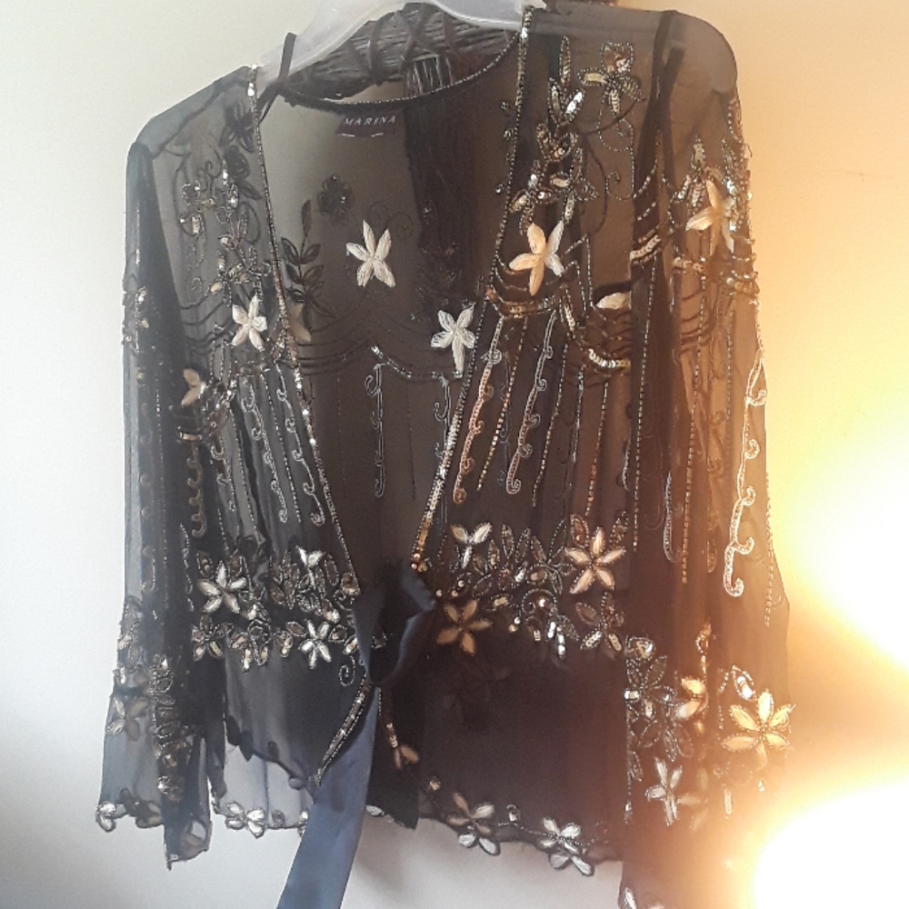 Elegant semi sheer jacket. Wear with ragged jeans